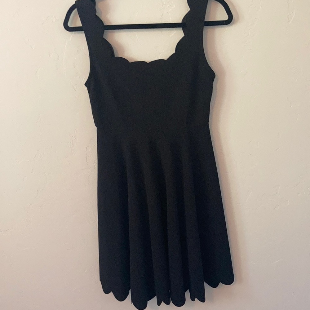 Brand is  Ivory. It is size medium. Black cocktail dress